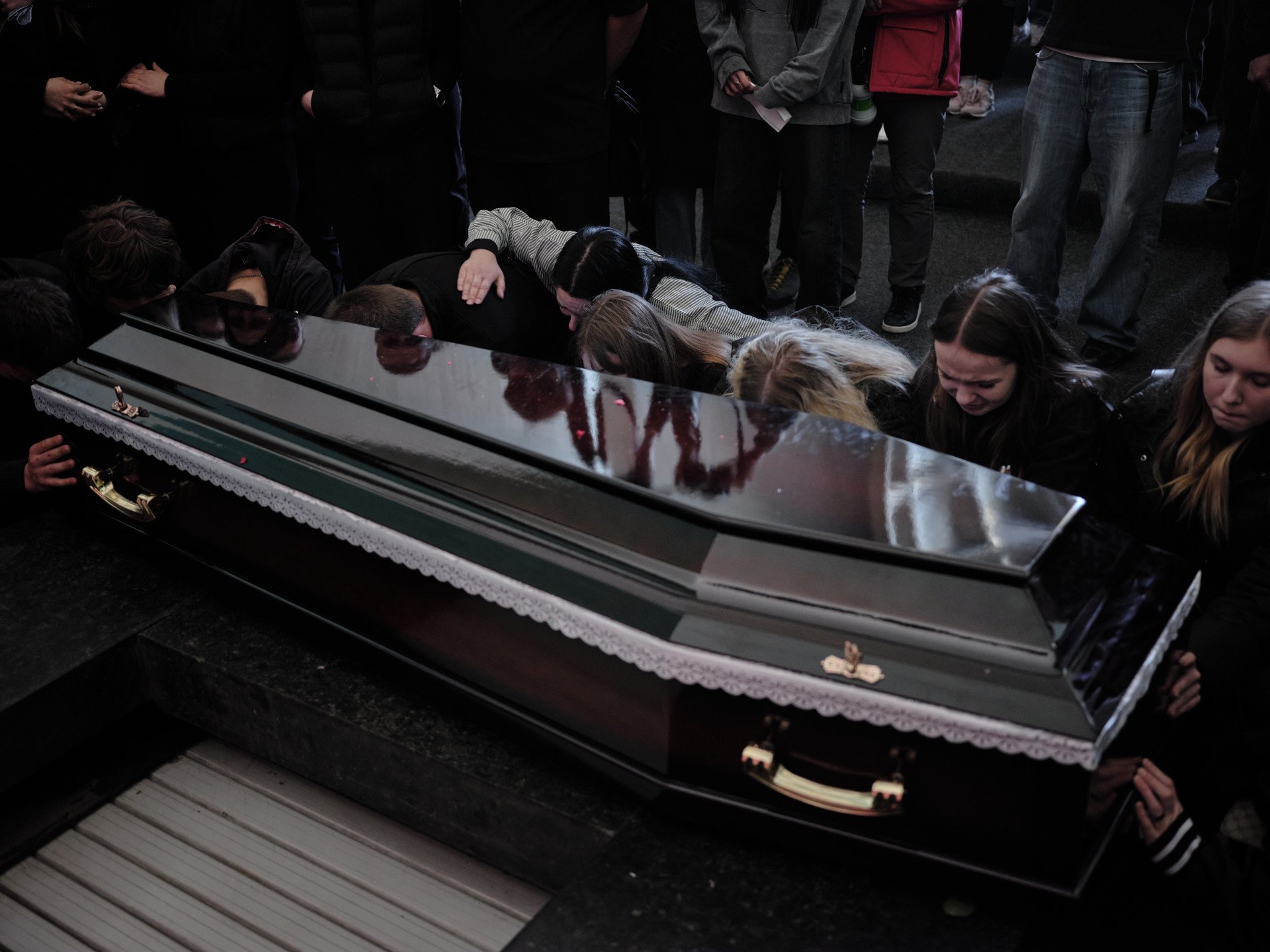Mourners sat beside the coffins of Danylo Khudia, his father Oleh, and his mother Viktoriia Khudia at the Kyiv Crematorium on April 28, 2025. Their bodies had remained buried under rubble for several hours after the missile strike, as classmates and neighbors gathered at the site the following day, hoping they would be found alive. (Photo: Joshua Olley) Mourners sat beside the coffins of Danylo Khudia, his father Oleh, and his mother Viktoriia Khudia at the Kyiv Crematorium on April 28, 2025. Their bodies had remained buried under rubble for several hours after the missile strike, as classmates and neighbors gathered at the site the following day, hoping they would be found alive. (Photo: Joshua Olley)