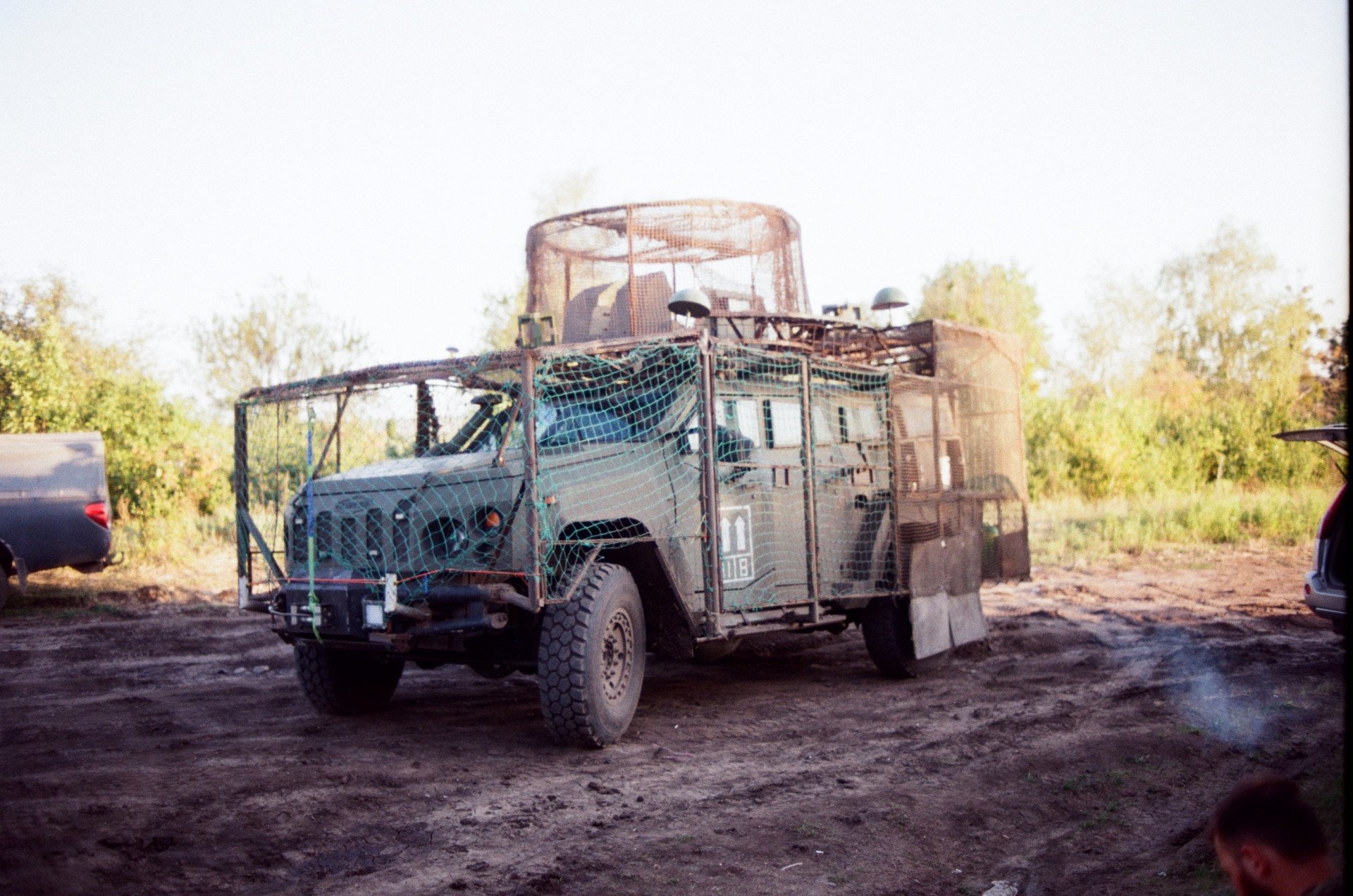 An APC, commonly used to shuttle soldiers to and from positions. Recently these vehicles have been kitted out with anti-drone nets. Ukraine, August 2025. Photo by Lucile Brizard/UNITED24 Media.