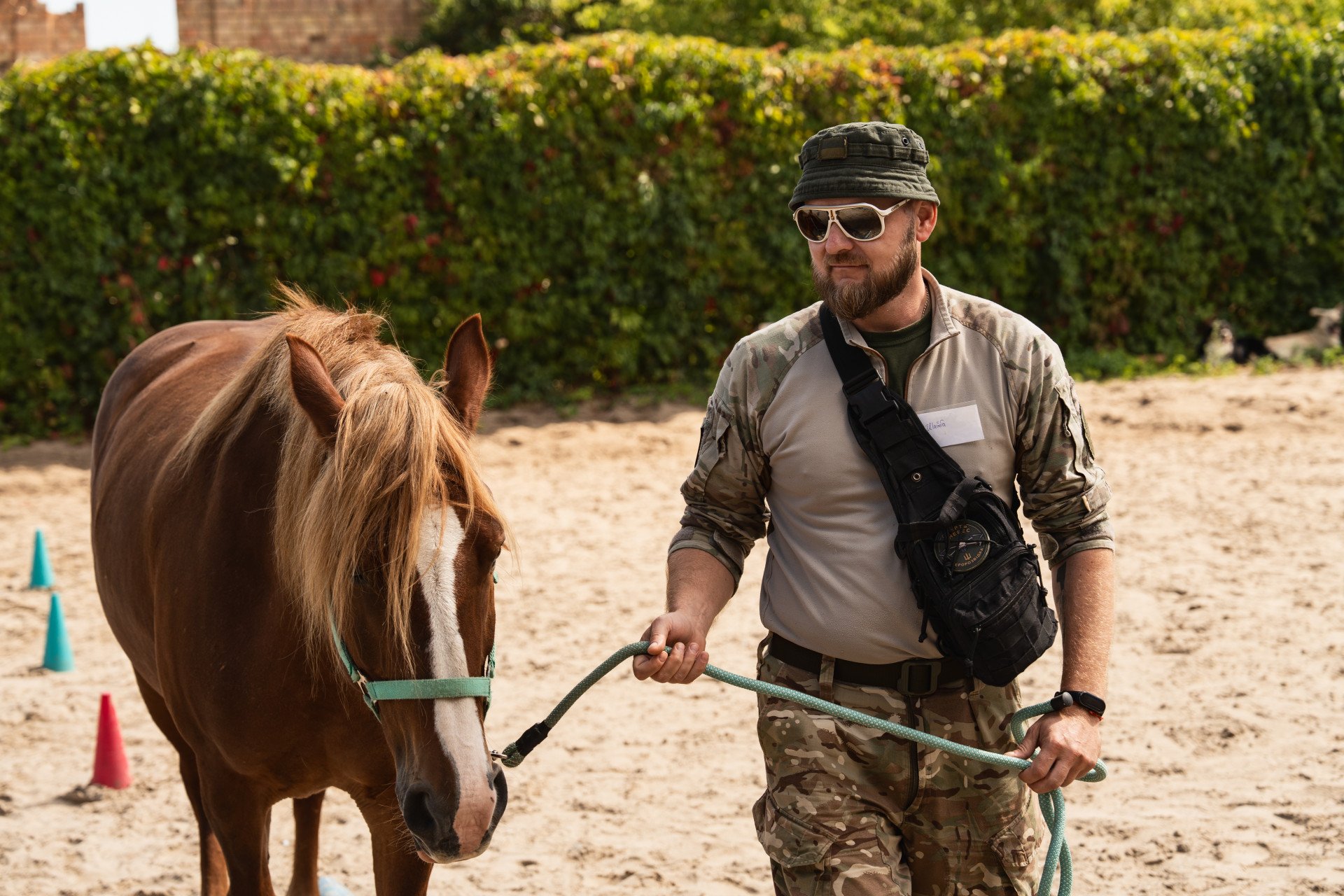 “Shaiba,” a defender with the Rubizh Brigade takes a moment to connect with a horse during a therapy session at Solomakha Ranch. September 2026, Kyiv region. (Photo by Nika Lastvika/EquiReHab Ukraine) “Shaiba,” a defender with the Rubizh Brigade takes a moment to connect with a horse during a therapy session at Solomakha Ranch. September 2026, Kyiv region. (Photo by Nika Lastvika/EquiReHab Ukraine)