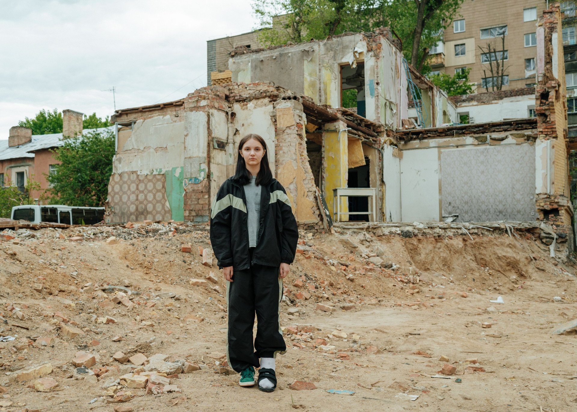 14-year-old Yana stands in front of the remains of her home destroyed by a Russian missile, May 20, 2025. (Source: Andrii Yushchak) 14-year-old Yana stands in front of the remains of her home destroyed by a Russian missile, May 20, 2025. (Source: Andrii Yushchak)