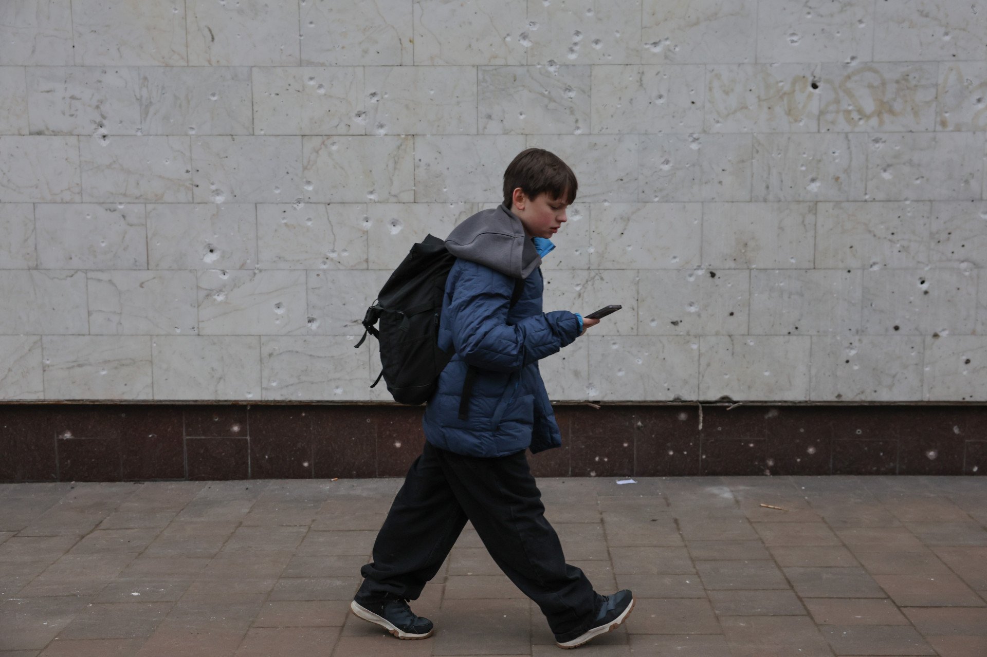 JAN 21, 2025 — "In the Auschwitz-Birkenau (Oświęcim) concentration camp, there is a so-called “black wall” where the Nazis executed prisoners by shooting. I was there in 2018 and still remember the bullet marks. On January 18, after a Russian missile strike, hundreds of shrapnel marks appeared on the marble wall of a restaurant near the Lukyanivska metro station. Three people were killed next to it. I once thought that such walls were a thing of the past, but now, for the past 11 years, these “walls” are everywhere. This wall now also speaks of pain and loss, just like the one I once saw". Photo by Serhii Nuzhnenko for Radio Free Europe/Radio Liberty.