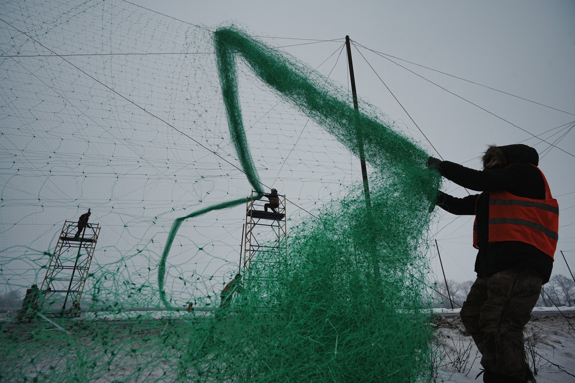 Municipal workers install anti-drone nets over a road in Kharkiv, Ukraine, on January 28, 2026, to help protect infrastructure and personnel from Russian drone attacks. (Photo by Viktoriia Yakymenko/Suspilne Ukraine/JSC “UA: PBC"/Global Images Ukraine via Getty Images) Municipal workers install anti-drone nets over a road in Kharkiv, Ukraine, on January 28, 2026, to help protect infrastructure and personnel from Russian drone attacks. (Photo by Viktoriia Yakymenko/Suspilne Ukraine/JSC “UA: PBC"/Global Images Ukraine via Getty Images)