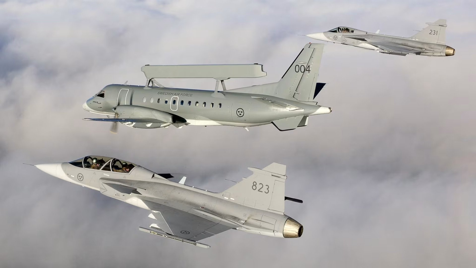 Swedish Air Force JAS-39 Gripen fighter jets with Saab 340 AEW&C aircraft in the air, circa 2008. (Source: SAAB)