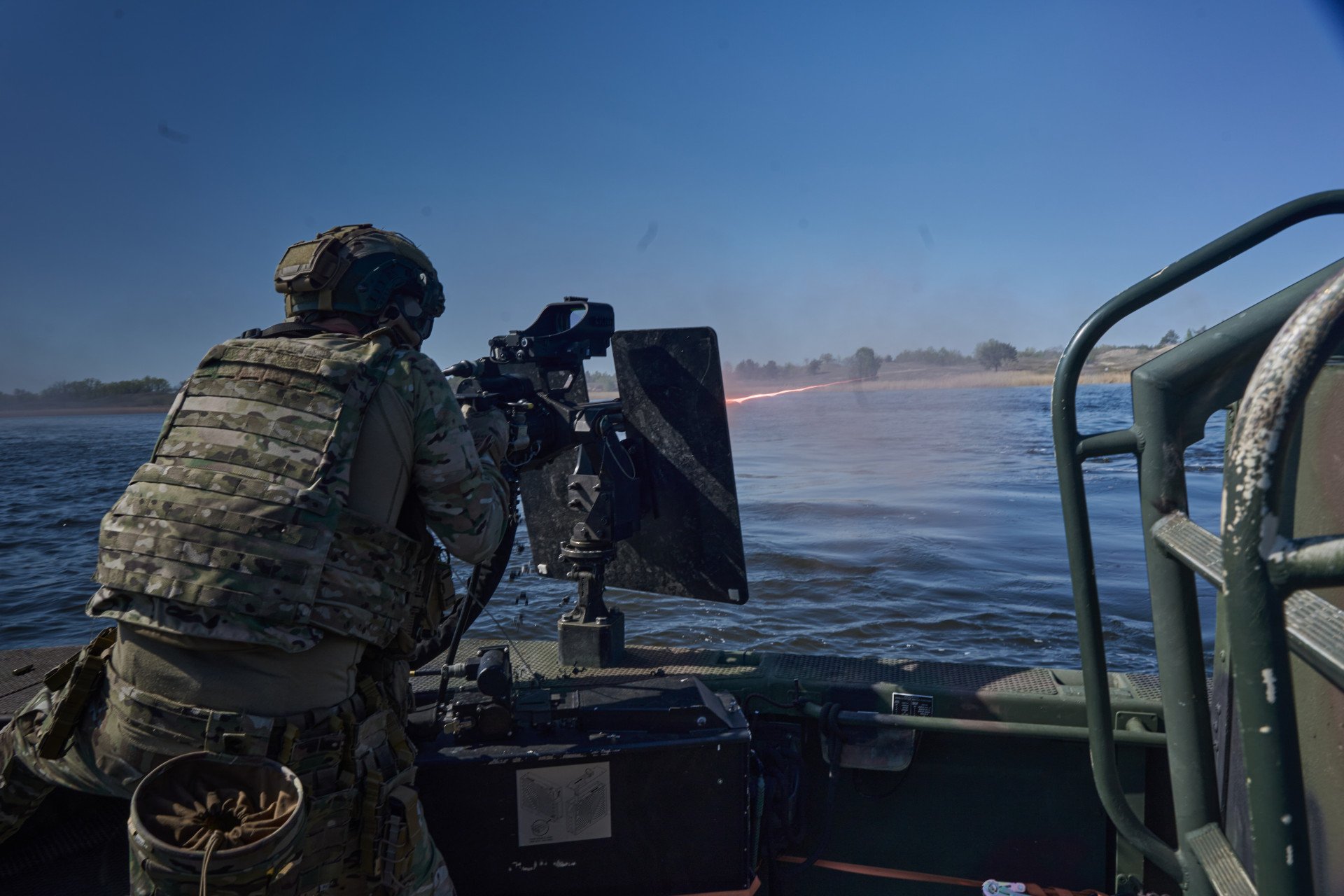 Before landing, SOF soldiers suppress enemy positions with all available weaponry to secure the unloading zone. Before landing, SOF soldiers suppress enemy positions with all available weaponry to secure the unloading zone.
