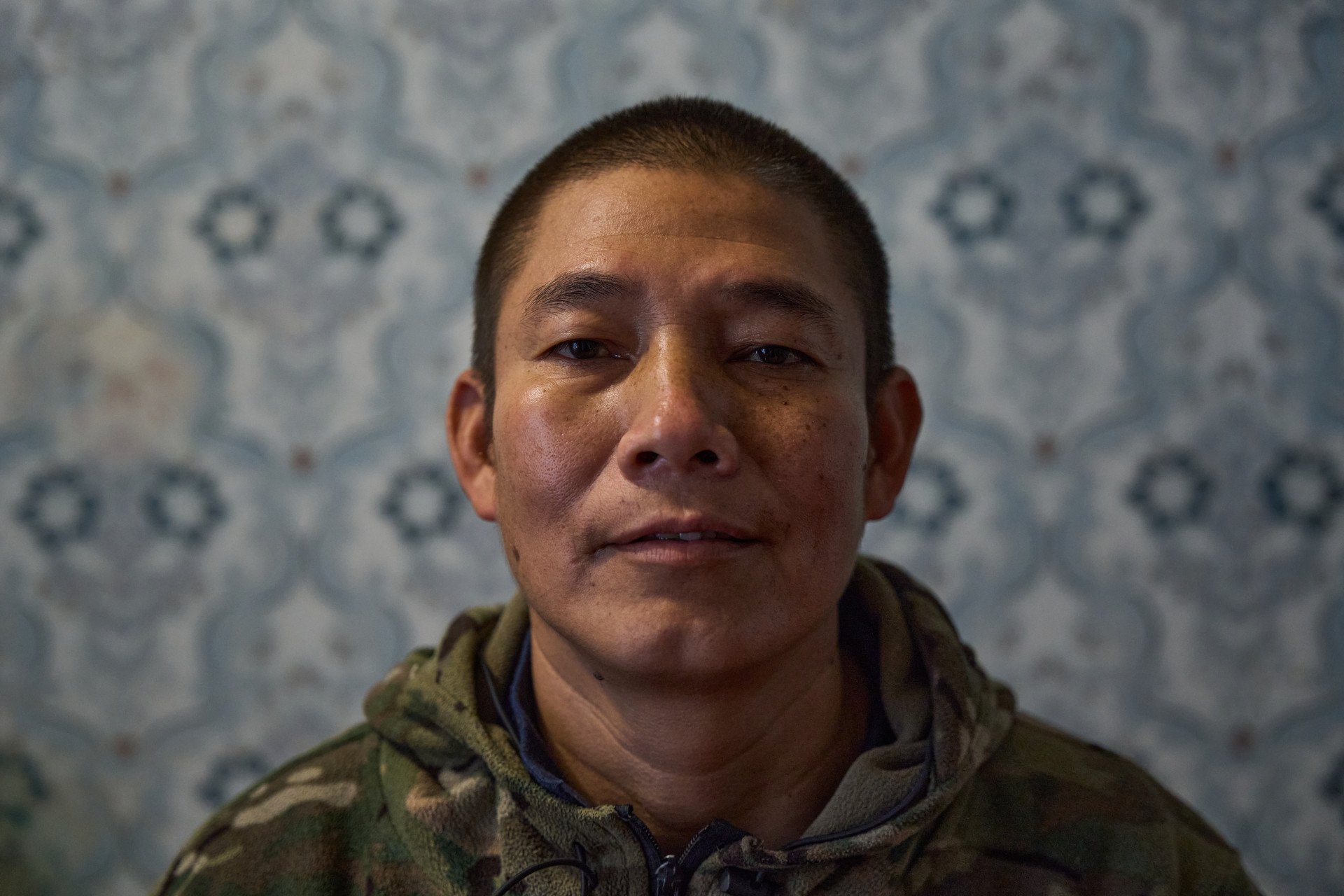 Americo Valdivia Teco, a 42-year-old former contract miner from Peru, pictured as a prisoner of war (POW) after being captured by Ukraine's Armed Forces. Valdivia Teco was lured to Russia under the pretense of high-paying jobs in the oil and gas sector, only to be forcefully recruited into the Russian military to serve on the frontlines in occupied Ukraine. (Photo: Mykyta Shandyba / UNITED24 Media) Close-up portrait of Americo Valdivia Teco, a 42-year-old prisoner of war (POW) from Peru held in Ukraine, who left contract mining work after being lured to Russia by false promises of oil and gas jobs.