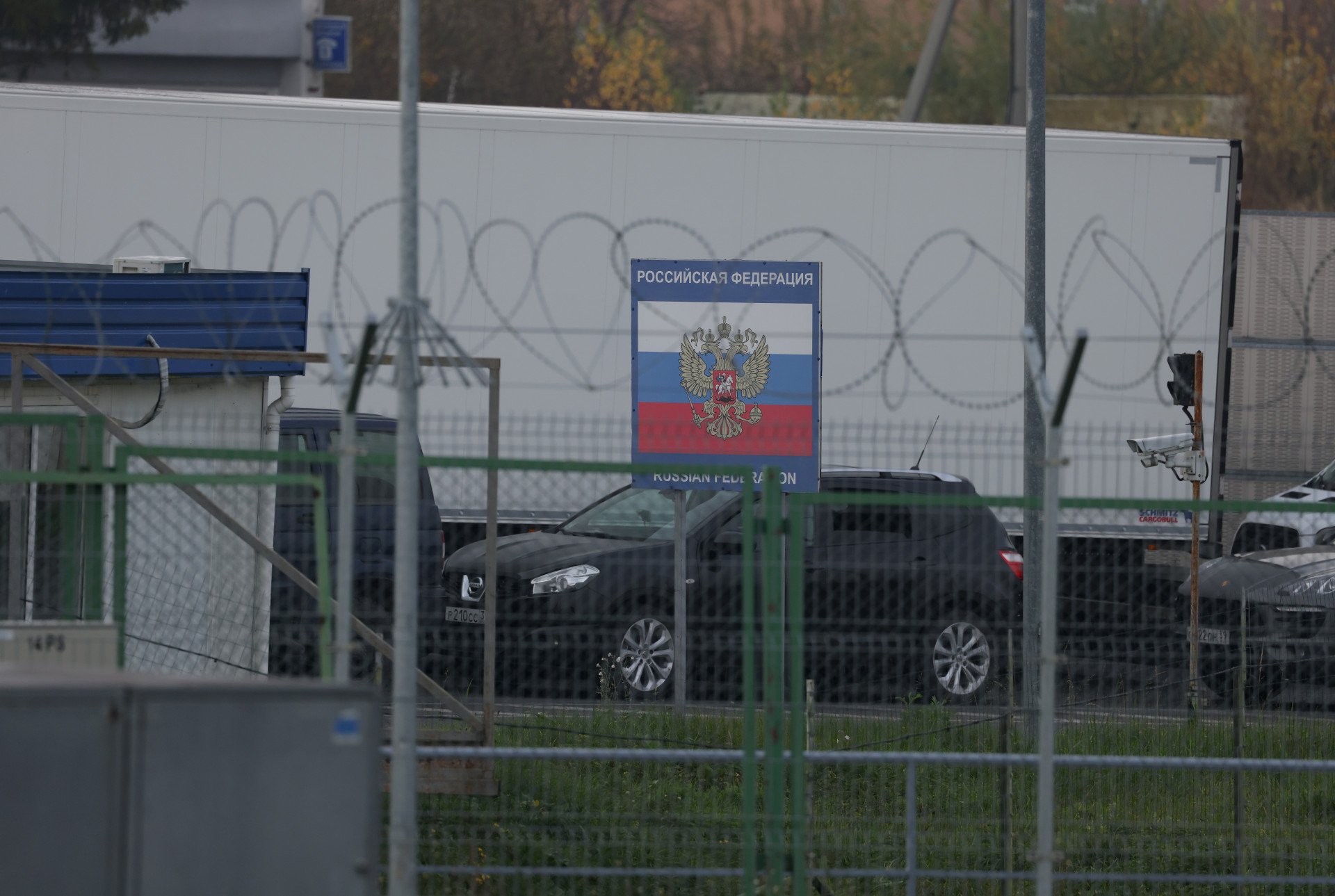 Trucks and cars line up on the Russian side of the border