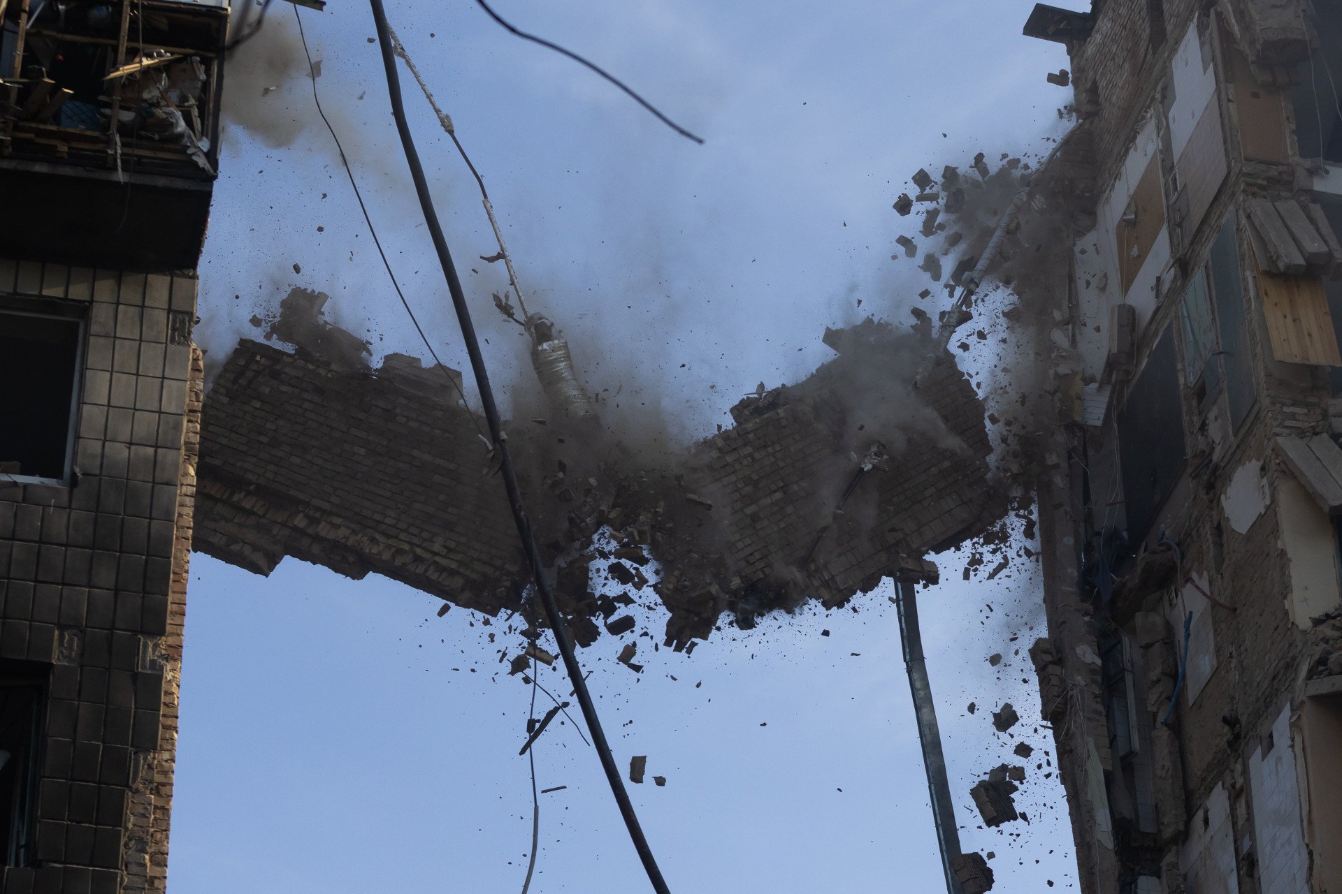 Rescuers deinstall hanging construction of partially collapsed residential building after a Russian drone-and-missile attack on June 17, 2025 in Kyiv, Ukraine. Rescuers continue to search for people under the rubble. (Photo by Yevhenii Zavhorodnii via Getty Images)