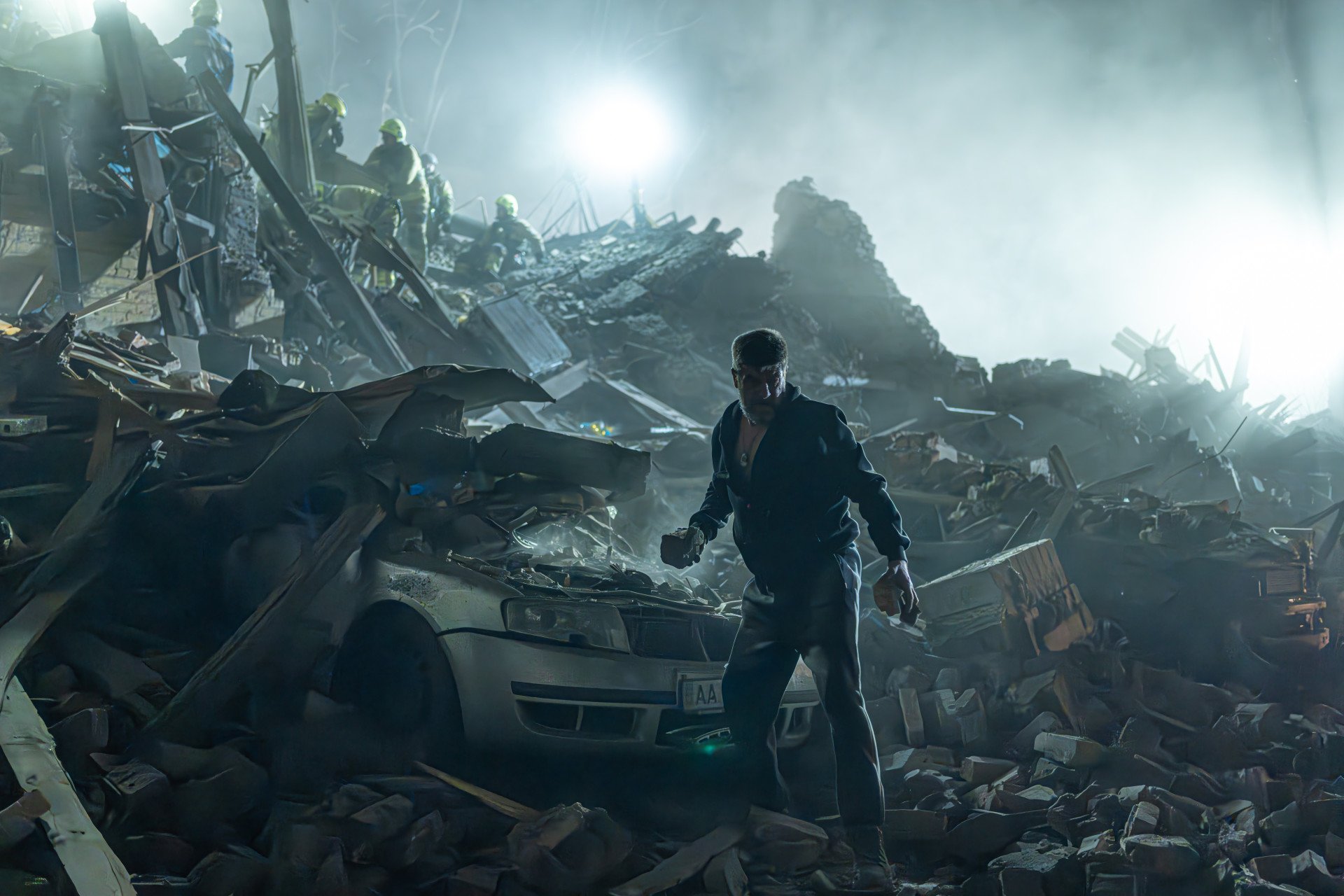 Side by side in tragedy: volunteers and emergency crews sift through the ruins, racing to find life beneath the concrete on April 24, 2025, in Kyiv, Ukraine. (Photo: Anton Shtuka @shtukaanton)