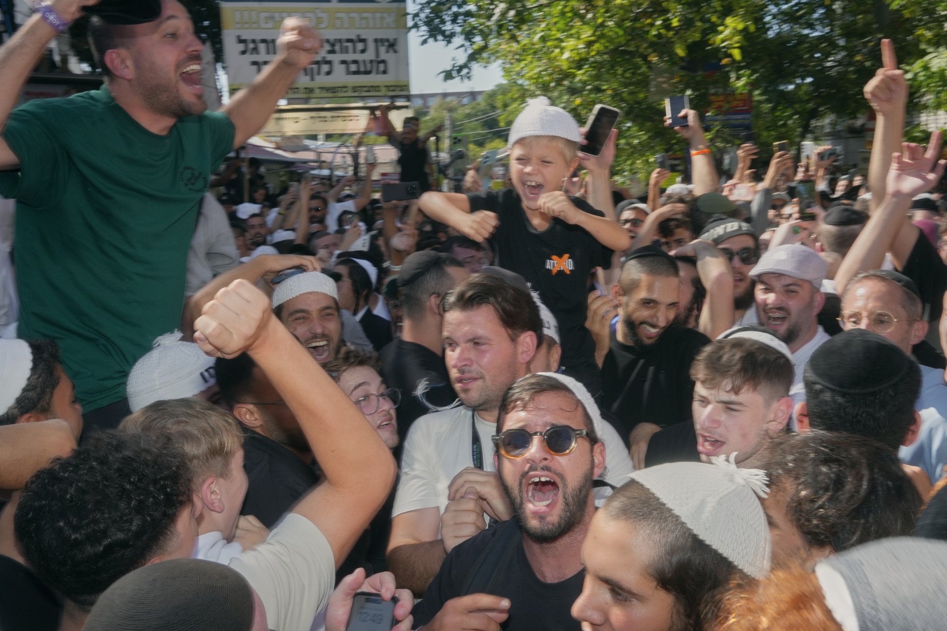 Jewish pilgrims dance in the street of Uman for Rosh Hashanah. An estimate of 35,000 jews travel to the holy city of Uman each year. September, 2025. Photo: Josh Olley/UNITED24 Media