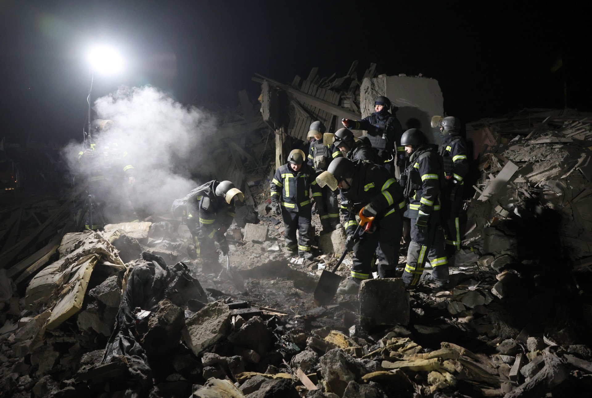  On February 9, rescuers from Ukraine’s State Emergency Service and National Police are seen at the scene of an airstrike that hit Kramatorsk. Photo by Anatolii Stepanov
