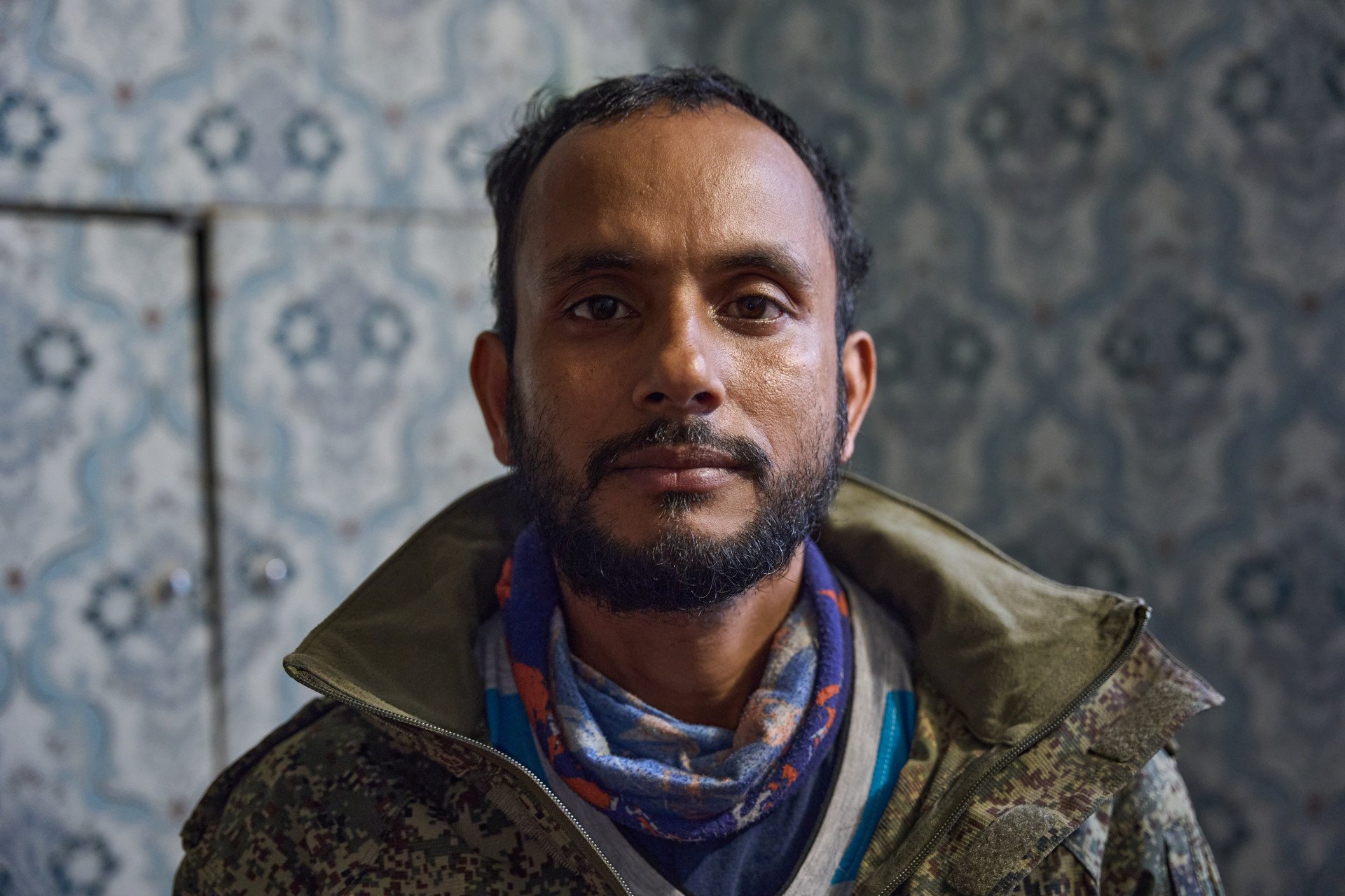 Kamrul Hasan, a Bangladeshi national pictured as a prisoner of war (POW) after being captured by Ukraine's military. Hasan was forcefully conscripted into the Russian Armed Forces and deployed to Russian-occupied areas of Ukraine before his capture. (Photo: Mykyta Shandyba / UNITED24 Media) Close-up portrait of Kamrul Hasan, a prisoner of war (POW) from Bangladesh held in Ukraine, who was forcefully conscripted into the Russian army and captured in Russian-occupied Ukraine.