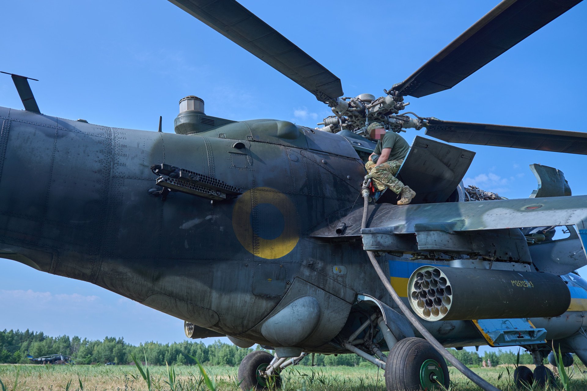 Refueling the Mi-24 helicopter ahead of takeoff. Refueling the Mi-24 helicopter ahead of takeoff.
