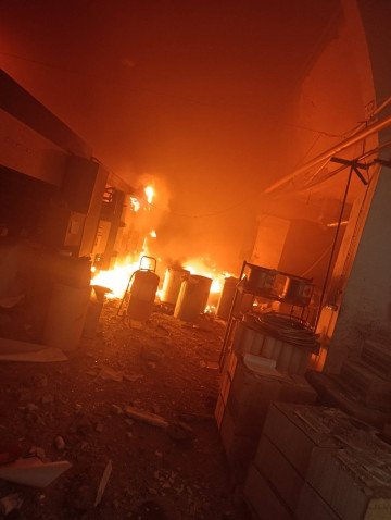 Fire engulfs the Konvi printing house in Kyiv after a Russian ballistic missile strike, destroying nearly 250,000 school textbooks prepared for the upcoming academic year. (Source: Viktoriia Haidai/Facebook) Fire engulfs the Konvi printing house in Kyiv after a Russian ballistic missile strike, destroying nearly 250,000 school textbooks prepared for the upcoming academic year. (Source: Viktoriia Haidai/Facebook)