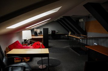 A spacious attic workspace with desks and seating inside Lebedev’s former Kyiv property. (Source: State Property Fund of Ukraine)