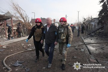 Ukrainian police paramedics escort a man away from the site of an airstrike in Zaporizhzhia. (Source: National Police of Ukraine)