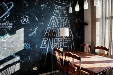 A dining area featuring a decorative mural inside Artemy Lebedev’s former apartment. (Source: State Property Fund of Ukraine)