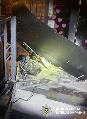 A piece of the drone’s debris is seen on the ground next to the building it struck. (Photo: National Police of Ukraine)