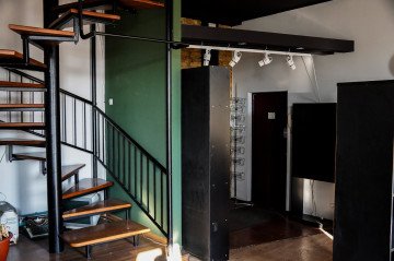 An interior staircase connecting the two levels of Artemy Lebedev’s former Kyiv apartment. (Source: State Property Fund of Ukraine)