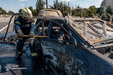 A firefighter works near a burned-out car following a Russian guided bomb strike on Kharkiv’s Shevchenkivskyi district. (Source: DSNS Kharkiv) A firefighter works near a burned-out car following a Russian guided bomb strike on Kharkiv’s Shevchenkivskyi district. (Source: DSNS Kharkiv)
