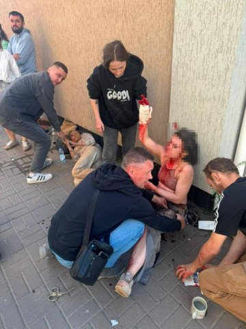 People assist the wounded outside the "We—Ukraine" television channel building after a Russian drone strike in Kyiv on September 8, 2026. (Source: DSNS Kyiv) People assist the wounded outside the "We—Ukraine" television channel building after a Russian drone strike in Kyiv on September 8, 2026.