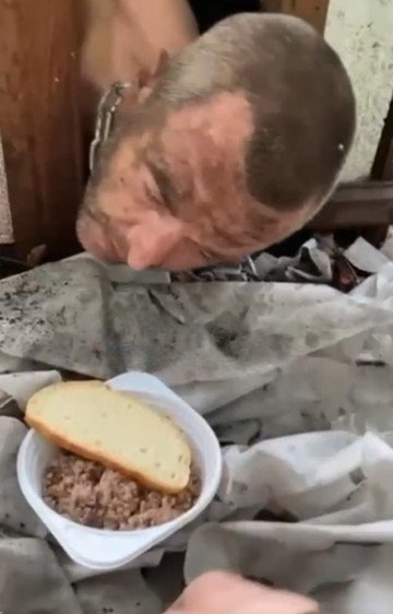 A Russian serviceman with visible injuries is shown restrained indoors in footage reportedly documenting abuse inside the Russian military. (Photo: open source) Russian serviceman