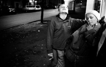 Homeless boys Dmytro and Maksym near a kiosk where they earned a living by joking with customers for cigarettes. Kyiv, 1996. Photo: Oleksandr Glyadyelov 