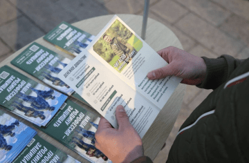 Russian military recruitment leaflets promoting contract service and financial incentives. 