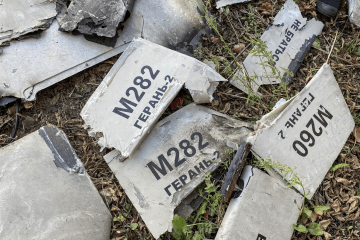 Wreckage of a Russian-launched Shahed-type drone lies in a field near Kyiv, with “Geran-2” markings visible. (Photo: open source)
