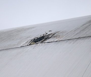 The roof of the New Safe Confinement over the number 4 reactor unit at the Chоrnobyl Nuclear Power Plant is damaged by a Russian drone strike on April 12, 2025. (Source: Getty Images) The roof of the New Safe Confinement over the number 4 reactor unit at the Chоrnobyl Nuclear Power Plant is damaged by a Russian drone strike on April 12, 2025. (Source: Getty Images)