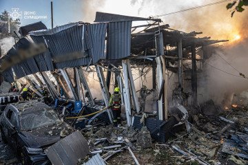 Firefighters work among the rubble and burning debris after a Russian drone strike hit an industrial site in Sumy, leaving buildings destroyed and vehicles damaged, on September 12, 2025. (Source: DSNS) Firefighters work among the rubble and burning debris after a Russian drone strike hit an industrial site in Sumy, leaving buildings destroyed and vehicles damaged, on September 12, 2025. (Source: DSNS)