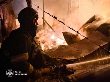 A State Emergency Service firefighter battles flames amid destroyed structures in the Kyiv region following an overnight Russian strike. (Source: DSNS Kyiv) A State Emergency Service firefighter battles flames amid destroyed structures in the Kyiv region following an overnight Russian strike. (Source: DSNS Kyiv)