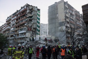 Ukrainian emergency services search through the rubble of a partially collapsed building following a Russian missile and drone attack on May 14, 2026, in Kyiv, Ukraine. (Source: Getty Images)