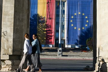 Two giant Moldovan and European Union flags displayed on the facade of the Government House of Moldova in Chisinau city center, in Chisinau, Moldova, on September 26, 2025. (Source: Getty Images)