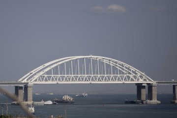 Cargo ships transit the Kerch Strait near the Crimean Bridge in July 2023. (Source: Getty Images)