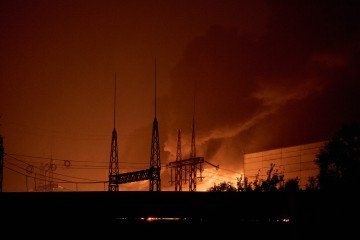 Firefighters battle flames at a thermal power plant following a series of explosions on October 10, 2025 in Kyiv, Ukraine. (Photo: Kostiantyn Liberov/Getty Images)