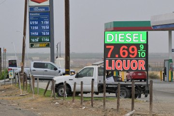 Gas prices, including diesel at $7.69 per gallon, are displayed at a gas station outside Taft, in Kern County, California, on October 21, 2026.
