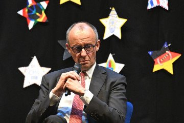 German Federal Chancellor Friedrich Merz takes part in a panel discussion with pupils on European issues during his visit to Carolus-Magnus-Gymnasium. (Source: Getty Images)