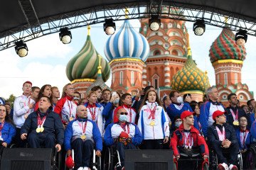 Russian Paralympians gather on the stage at Red Square during a welcoming ceremony in Moscow on September 6, 2021 upon the Russian Paralympic team's arrival from the Tokyo 2020 Paralympic Games. (Source: Getty Images)