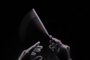 Hands holding the flag of Russia over a map of the Baltic states. Source: UNITED24 Media