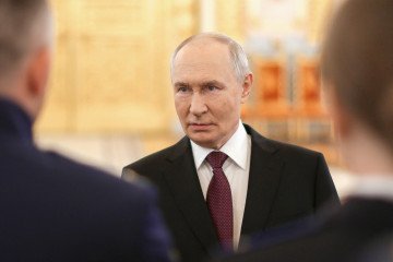 Putin Faces Calls to Delay Russian Elections as Economy Slows and Ukrainian Drone Strikes Intensify Russian leader Vladimir Putin talks to graduates of higher military educational institutions during a meeting at the Kremlin in Moscow on June 23, 2026. (Source: Getty Images)