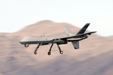 An MQ-9 Reaper remotely piloted aircraft (RPA) flies by during a training mission at Creech Air Force Base on November 17, 2015, in Indian Springs, Nevada. (Source: Getty Images)