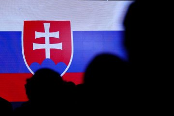 The Slovak flag is visible among people during the meeting of the presidents of the Arraiolos group at Wawel Castle in Krakow, Poland, on October 11, 2024. The Slovak flag is visible among people during the meeting of the presidents of the Arraiolos group at Wawel Castle in Krakow, Poland, on October 11, 2024.