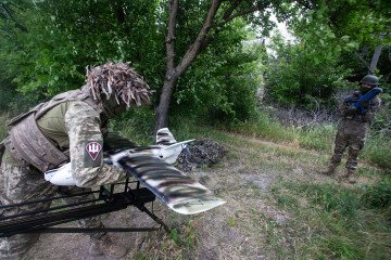 A Ukrainian soldier places a VB140 interceptor drone on a catapult while another soldier holds a UEB interceptor drone near the frontline on the outskirts of the city of Sumy, northeastern Ukraine, on June 13, 2026. (Source: Getty Images) A Ukrainian soldier places a VB140 interceptor drone on a catapult while another soldier holds a UEB interceptor drone near the frontline on the outskirts of the city of Sumy, northeastern Ukraine, on June 13, 2026. (Source: Getty Images)
