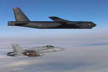 A US Air Force B-52H Stratofortress flies in formation with a Finnish Air Force F/A-18 Hornet during a joint training mission over eastern Finland near the Russian border. (Source: Finnish Air Force)