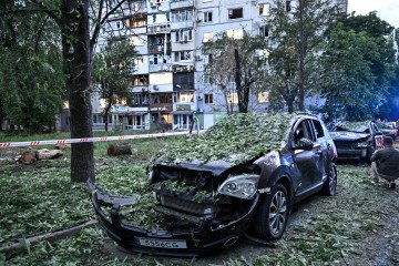 Damaged cars are seen outside a residential building following a drone strike in the Shevchenkivskyi district of Zaporizhzhia, Ukraine, on June 4, 2026. (Source: Getty Images)