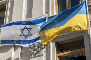 The national flags of Ukraine and Israel fly outside the Ministry of Foreign Affairs of Ukraine in Kyiv, Ukraine. (Source: Getty Images)