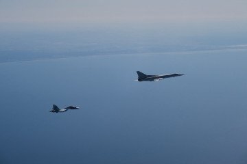 Russian Tu-22M3 bomber escorted by a Swedish JAS 39 Gripen fighter over the Baltic Sea during an interception mission. (Source: Swedish Air Force)