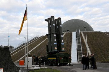People stand in front of the Arrow 3 shield system during an event of the German Air Force at the Annaburger Heide Air Base in Schoenewalde, eastern Germany, on December 3, 2025. Illustrative photo. (Source: Getty Images)