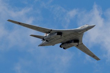 A Russian Tu-160 strategic bomber flies over the Kremlin during a military parade rehearsal in Moscow. (Source: Getty Images) A Russian Tu-160 strategic bomber flies over the Kremlin during a military parade rehearsal in Moscow. (Source: Getty Images)