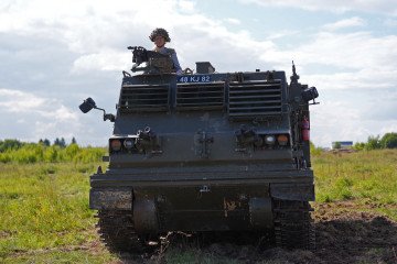 A soldier operates an armored vehicle during military training in Estonia. (Source: Getty Images)